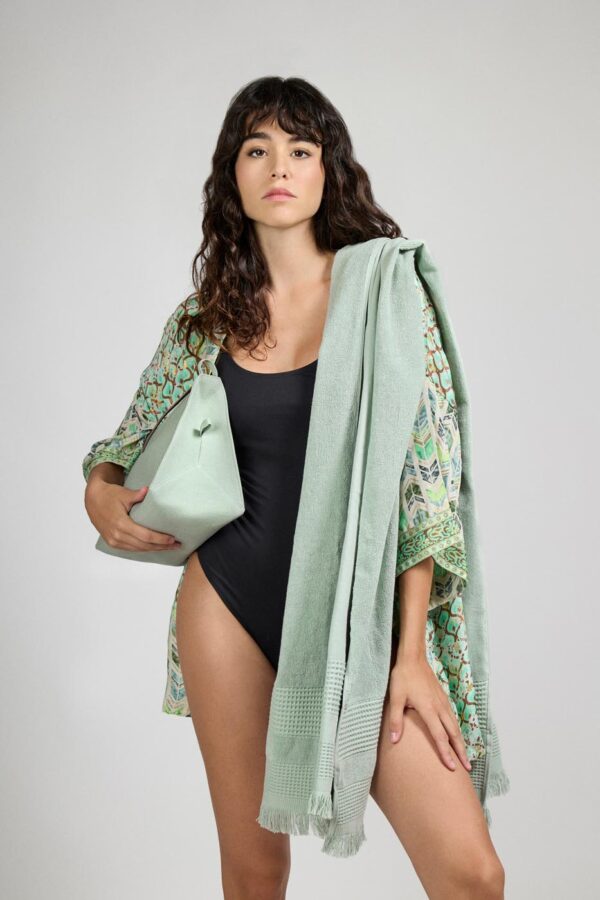 Wide towel made of soft cotton spunga with green bangs