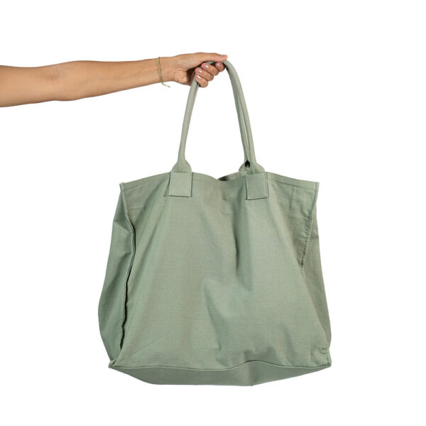 Wide bag made of green cotton canva