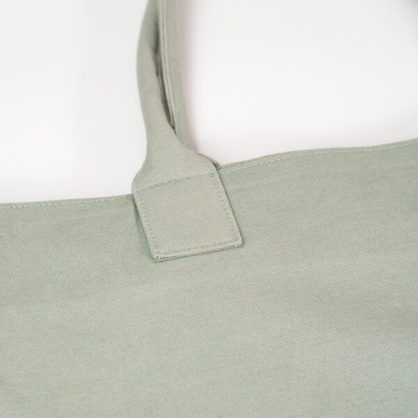 Wide bag made of green cotton canva