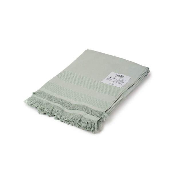 Wide folded towel made of soft cotton spunga with green bangs