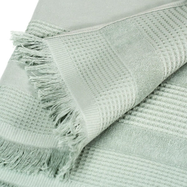 Wide towel made of soft cotton spunga with green bangs