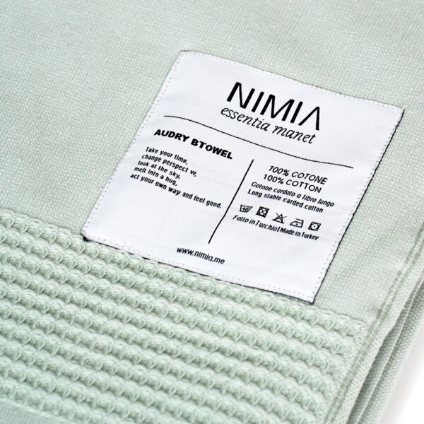 Wide towel made of soft cotton spunga with green bangs